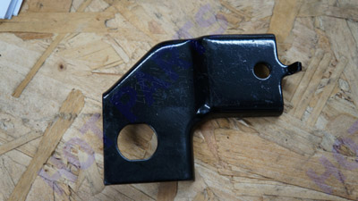 Bracket, clutch outlet hose